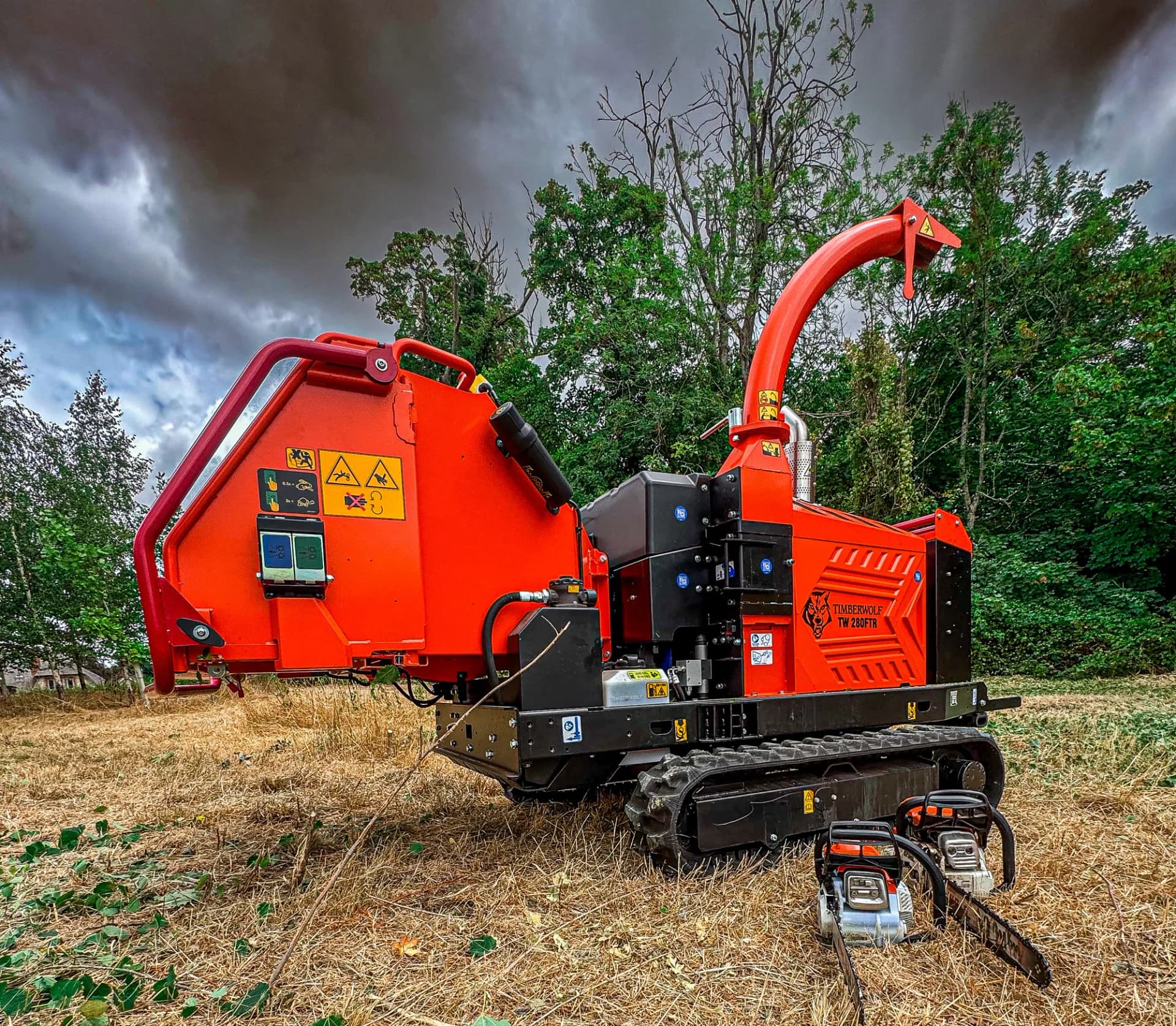 Timberwolf TW 280FTR tracked wood chipper and chainsaws on a Hampshire field after clearance work